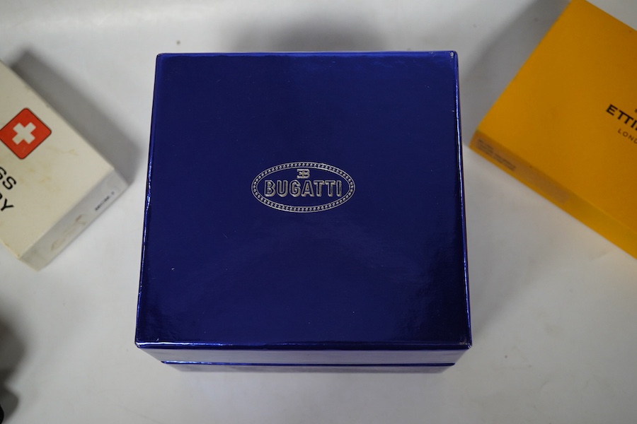 Sundry items comprising, two luxury wallets, boxed, Swiss military lighter and gent's manicure set. Condition - fair